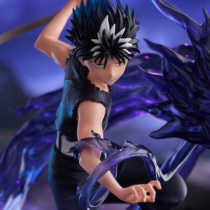 Vertical close-up action view highlighting Hiei's intense eyes, black wrist aura, and spiked black hair.