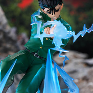 Dynamic low-angle close-up of Yusuke Urameshi channeling spiritual energy in front of scenic outdoor backdrop.