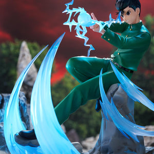 Full-body side angle of Yusuke Urameshi DRESSTA figure staged against rocky mountain terrain.