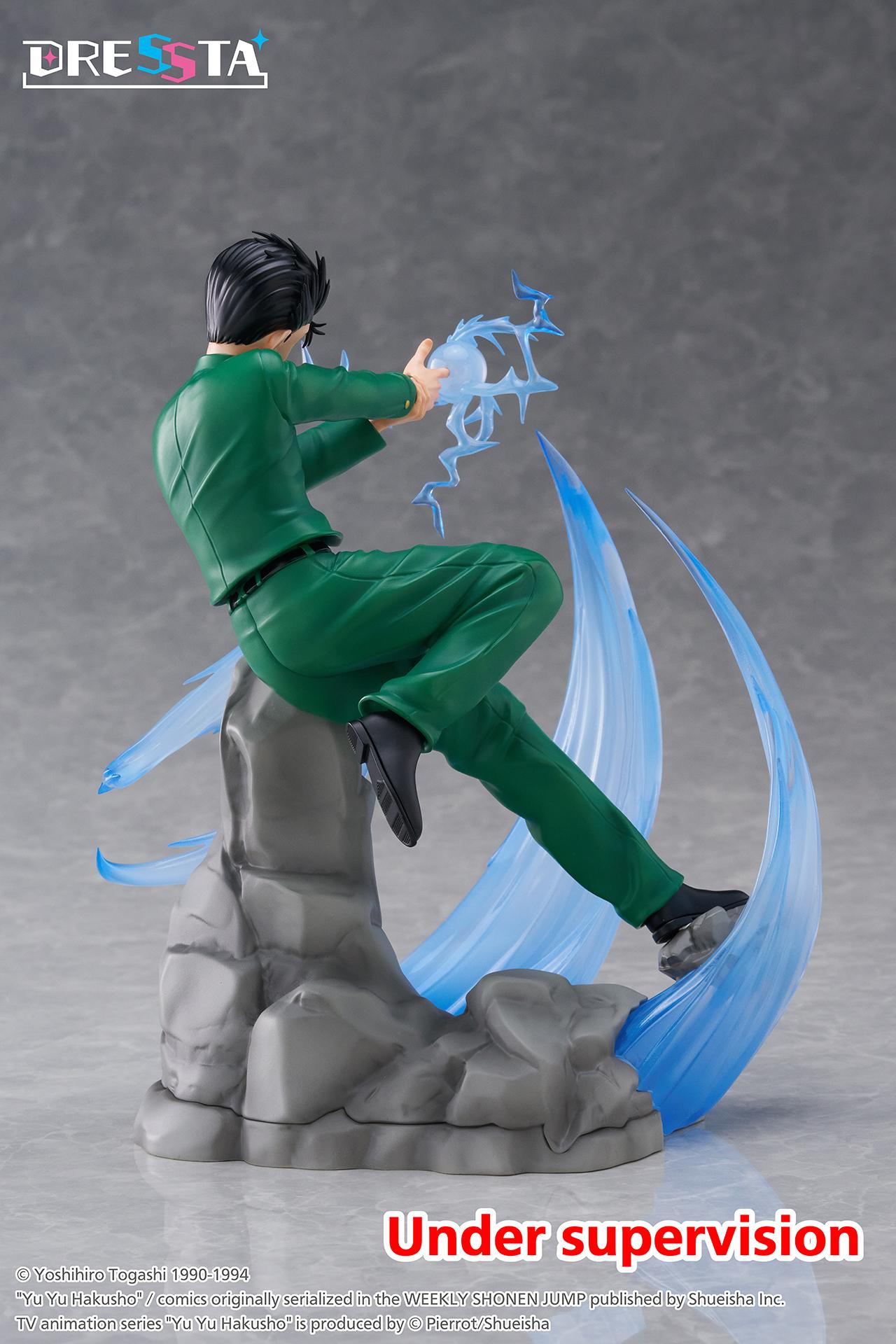 Rear back view of Yusuke Urameshi DRESSTA figure showing green uniform sculpt, hair details, and rock diorama base.