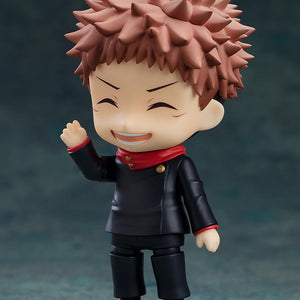 Cheerful posing of the Yuji Itadori Nendoroid with eyes closed and a wide grin, waving one hand.