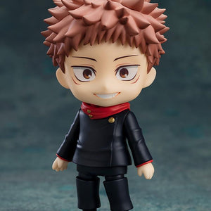 Yuji Itadori Nendoroid standing on a clear base featuring a bright smiling face plate.