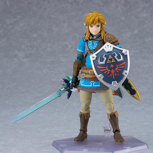 Classic front-facing hero pose of the figma Link DX Edition on a clear hexagonal display stand.