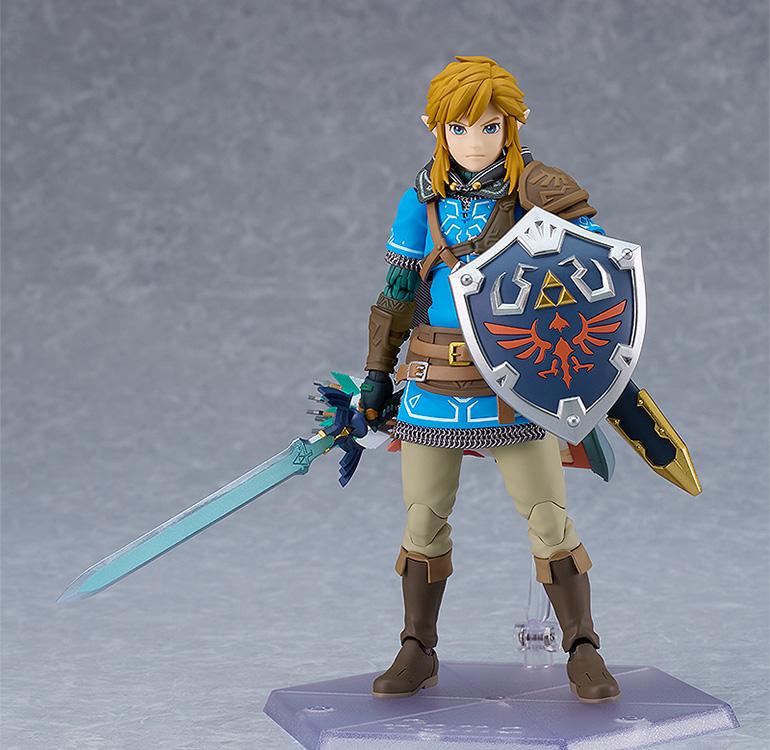Classic front-facing hero pose of the figma Link DX Edition on a clear hexagonal display stand.