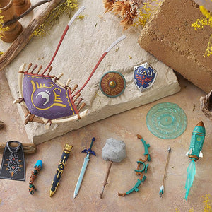 Artistic flatlay of Link's accessories including the Master Sword, Hylian Shield, and various fusion items.
