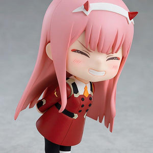 Side view of the Zero Two Nendoroid leaning forward with a joyful expression and hands behind her back.
