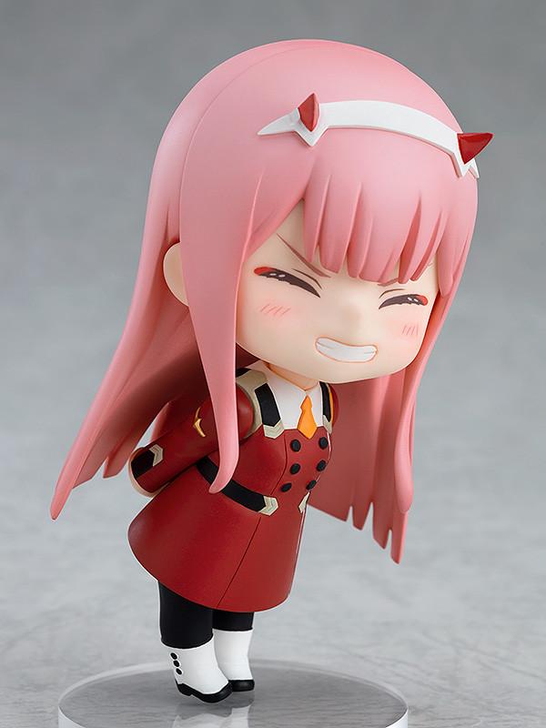 Side view of the Zero Two Nendoroid leaning forward with a joyful expression and hands behind her back.