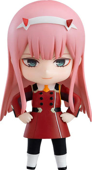 Full body shot of the Zero Two Nendoroid figure in her red uniform with pink hair and red horns.