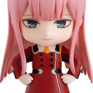 Full body shot of the Zero Two Nendoroid figure in her red uniform with pink hair and red horns.