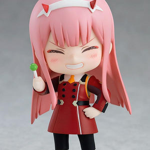 Zero Two Nendoroid figure holding a green sucker accessory with a happy, wide-grinned face plate.