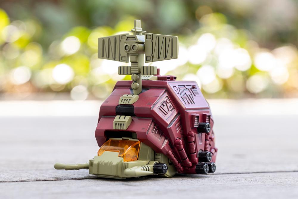 Kotobukiya Zoids D-Style Gustav Moonbay model kit displayed outdoors with blurred natural background