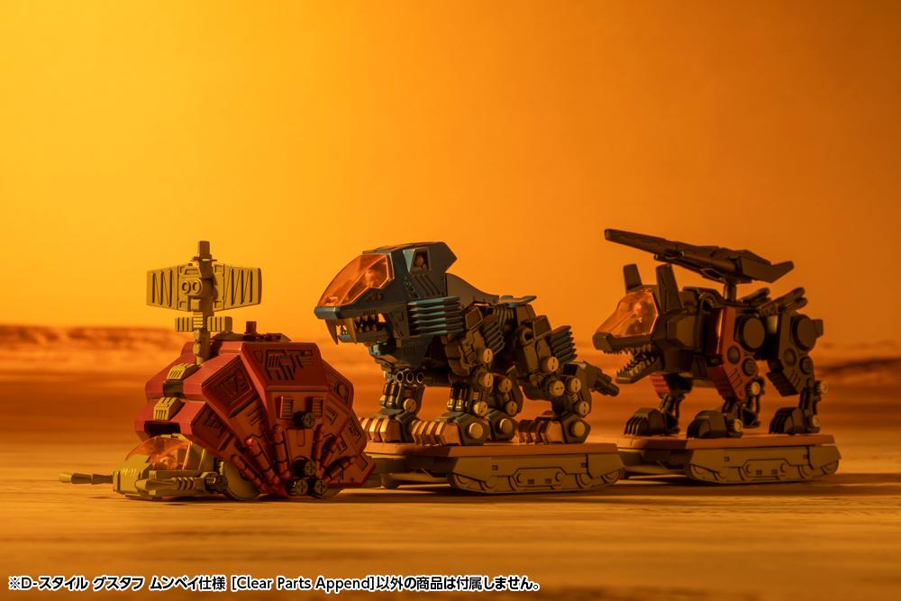 Wasteland diorama scene showing D-Style Gustav pulling loaded Zoids trailers under warm orange sunset lighting