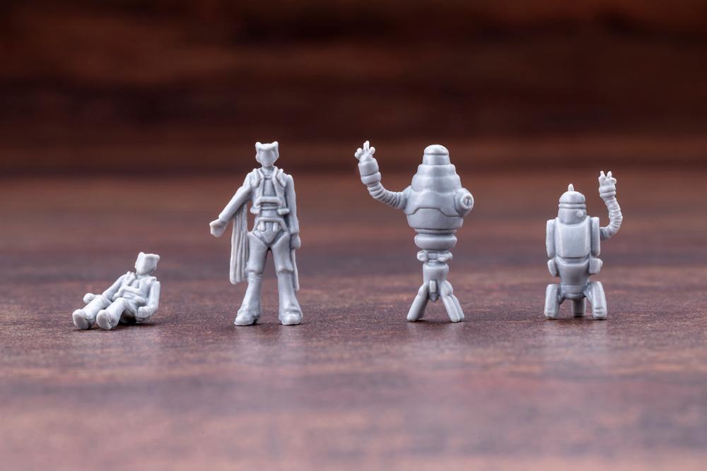 Included unpainted mini figures of Harry Champ pilot, standing Harry Champ, and assistant robots Benjamin and Sebastian.