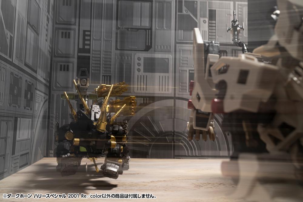 Dark Horn Harry Special model kit positioned aiming its heavy weaponry down an enclosed futuristic facility corridor.